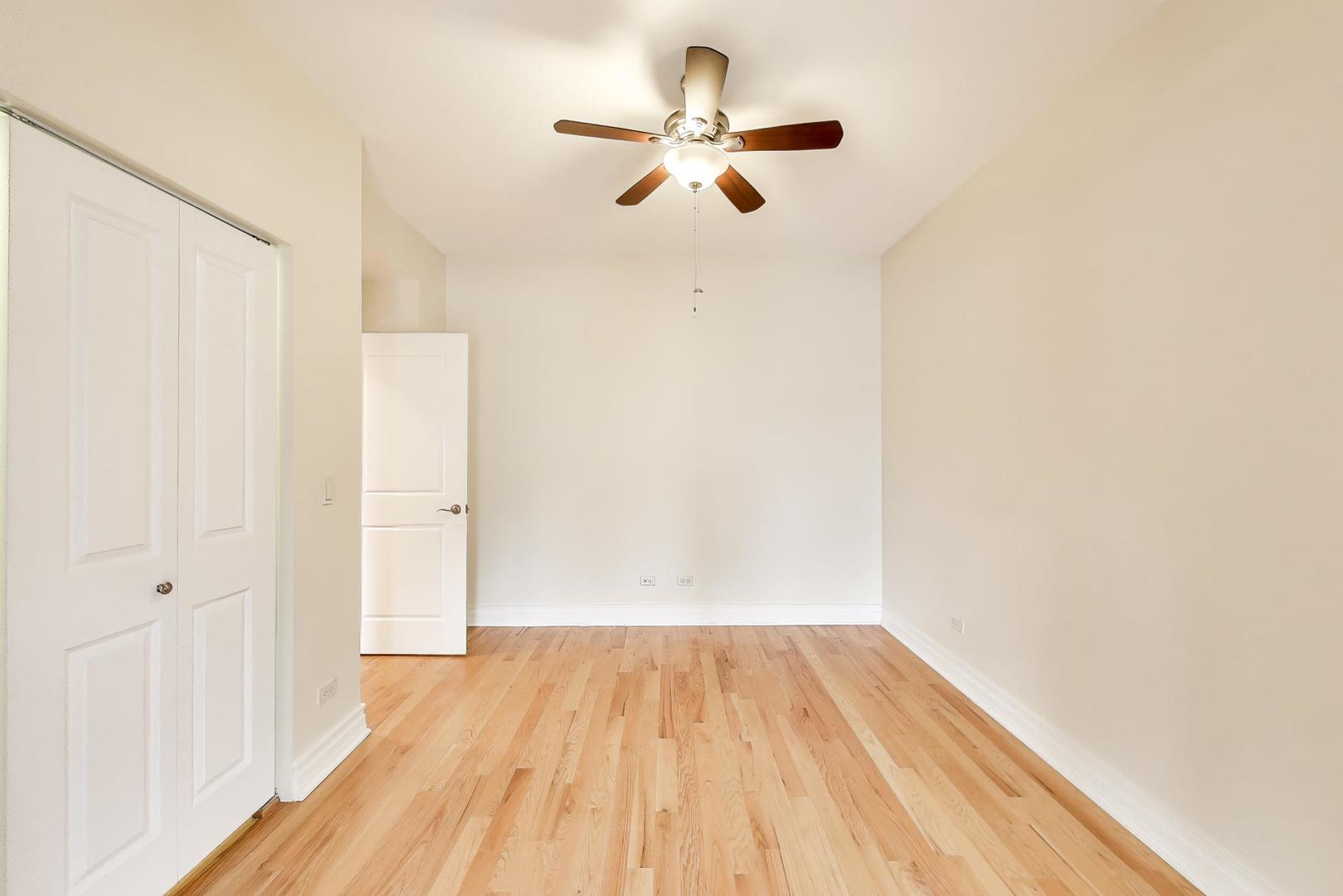 1640 West Fargo Avenue, Unit 101 Chicago, IL 60626 - Photo 13 of 22 a view of empty room with wooden floor