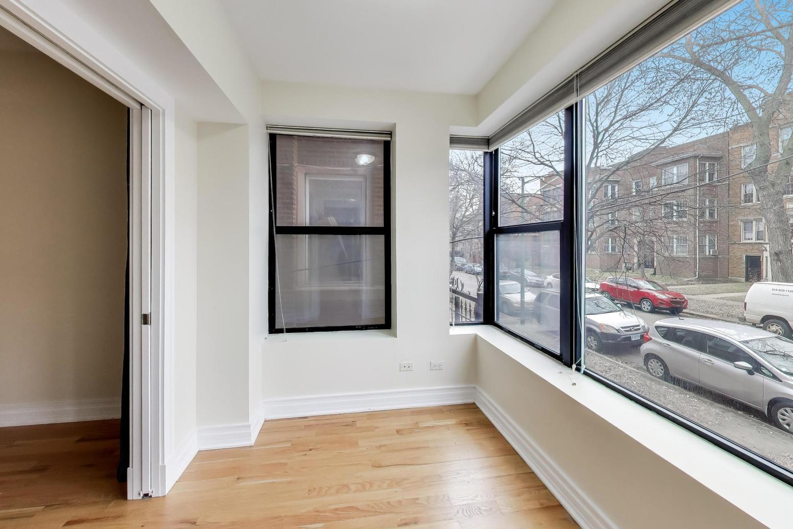1640 West Fargo Avenue, Unit 101 Chicago, IL 60626 - Photo 15 of 22 a view of a living room with a large window
