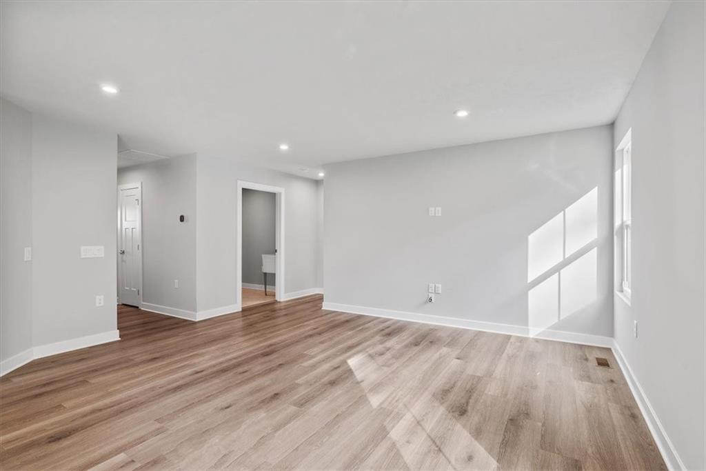 851 Ashley Road Gibsonia, PA 15044 - Photo 19 of 50 a view of an empty room with wooden floor