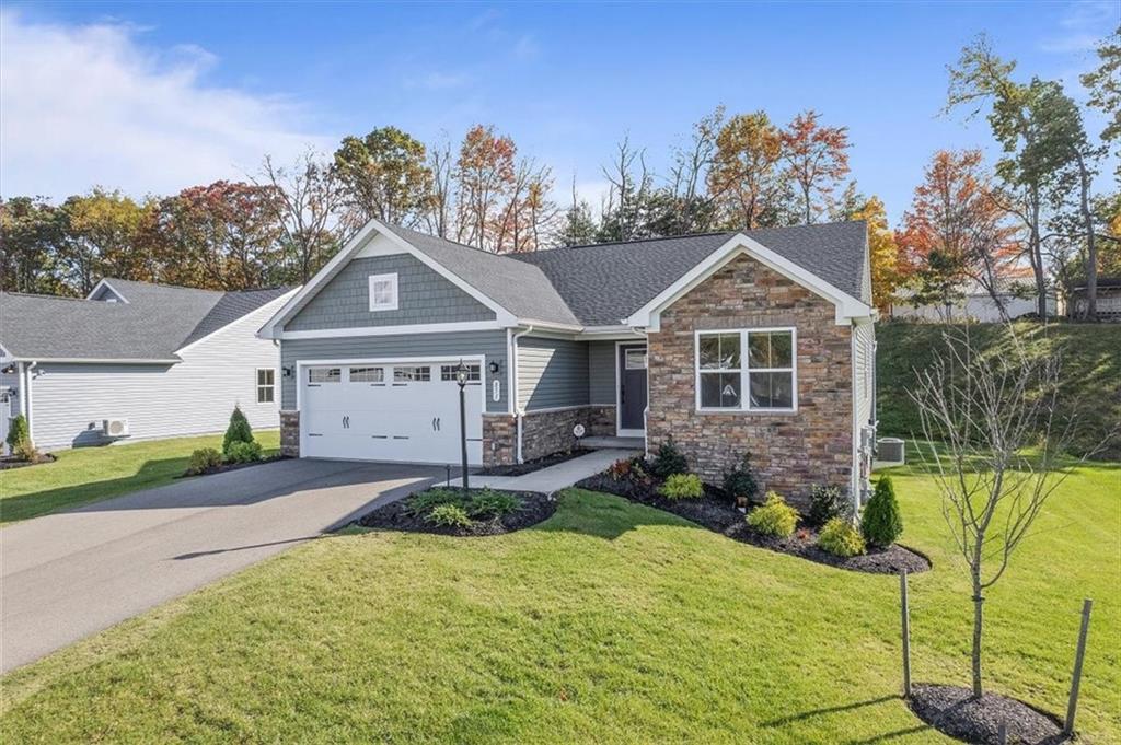 851 Ashley Road Gibsonia, PA 15044 - Photo 2 of 50 a front view of a house with a yard