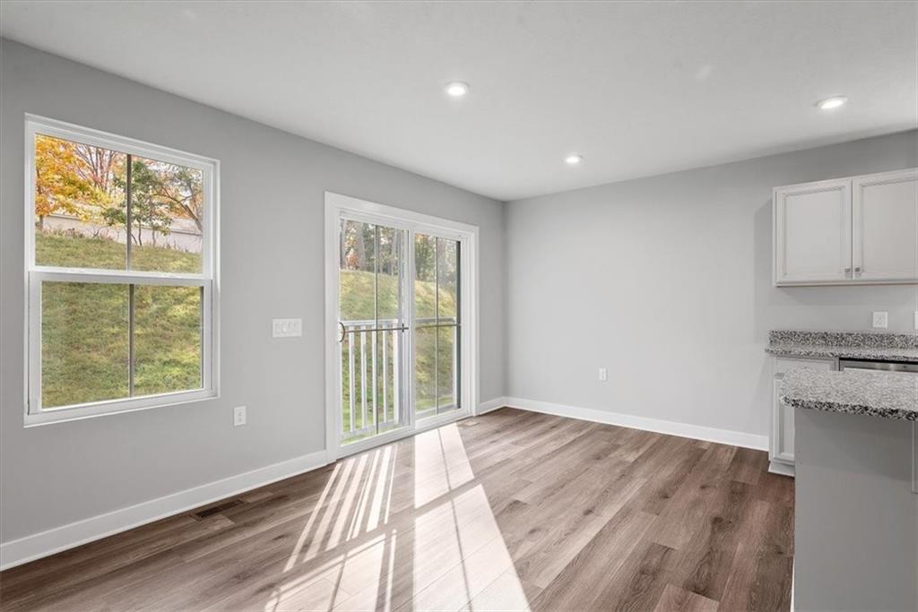 851 Ashley Road Gibsonia, PA 15044 - Photo 21 of 50 a view of a kitchen with wooden floor and a window