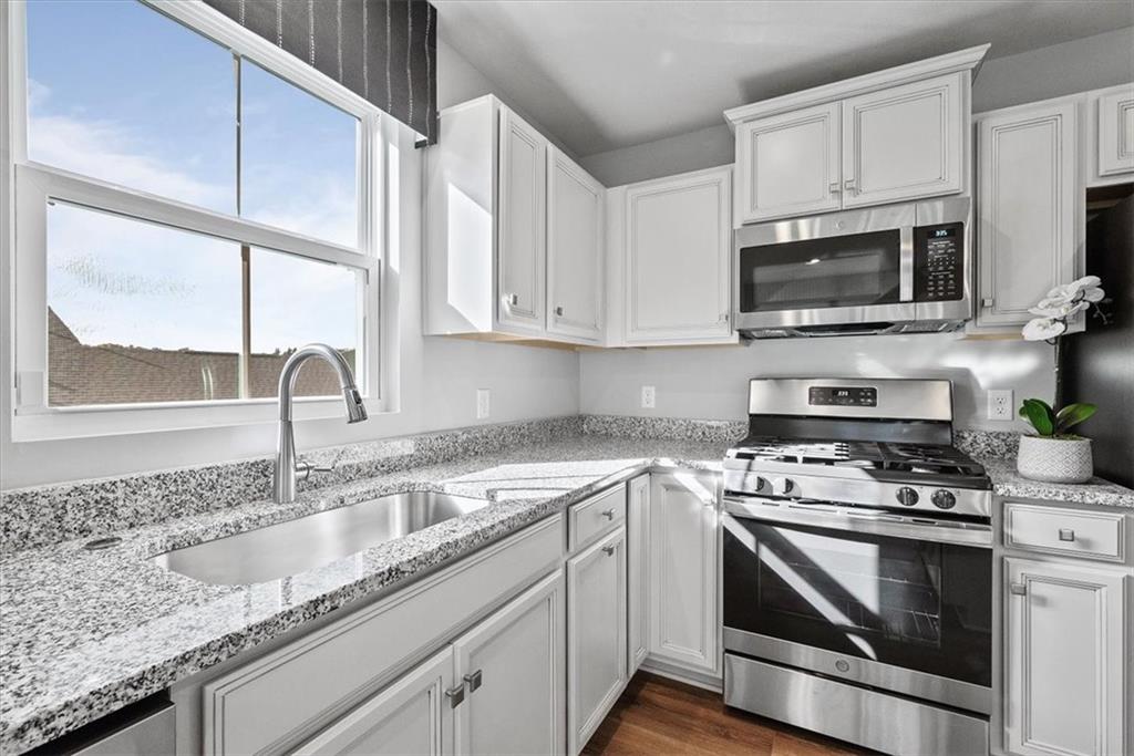 851 Ashley Road Gibsonia, PA 15044 - Photo 27 of 50 a kitchen with granite countertop a sink cabinets and stainless steel appliances