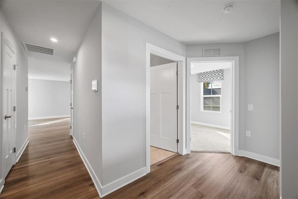 851 Ashley Road Gibsonia, PA 15044 - Photo 7 of 50 a view of a hallway with wooden floor