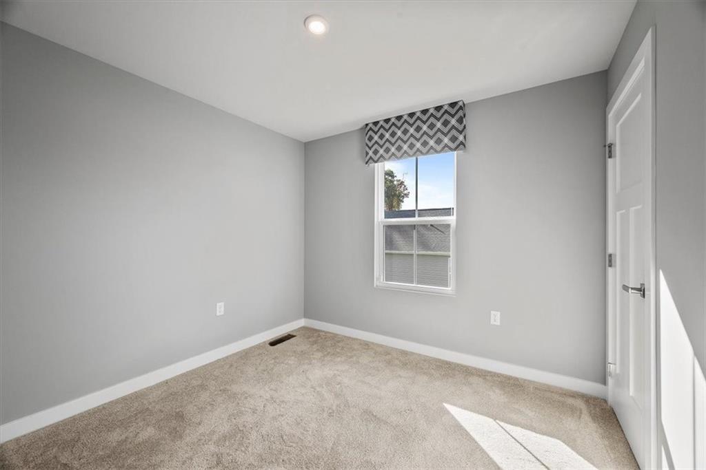 851 Ashley Road Gibsonia, PA 15044 - Photo 9 of 50 an empty room with windows