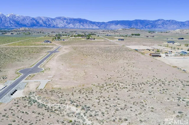 a view of a mountain with an ocean beach