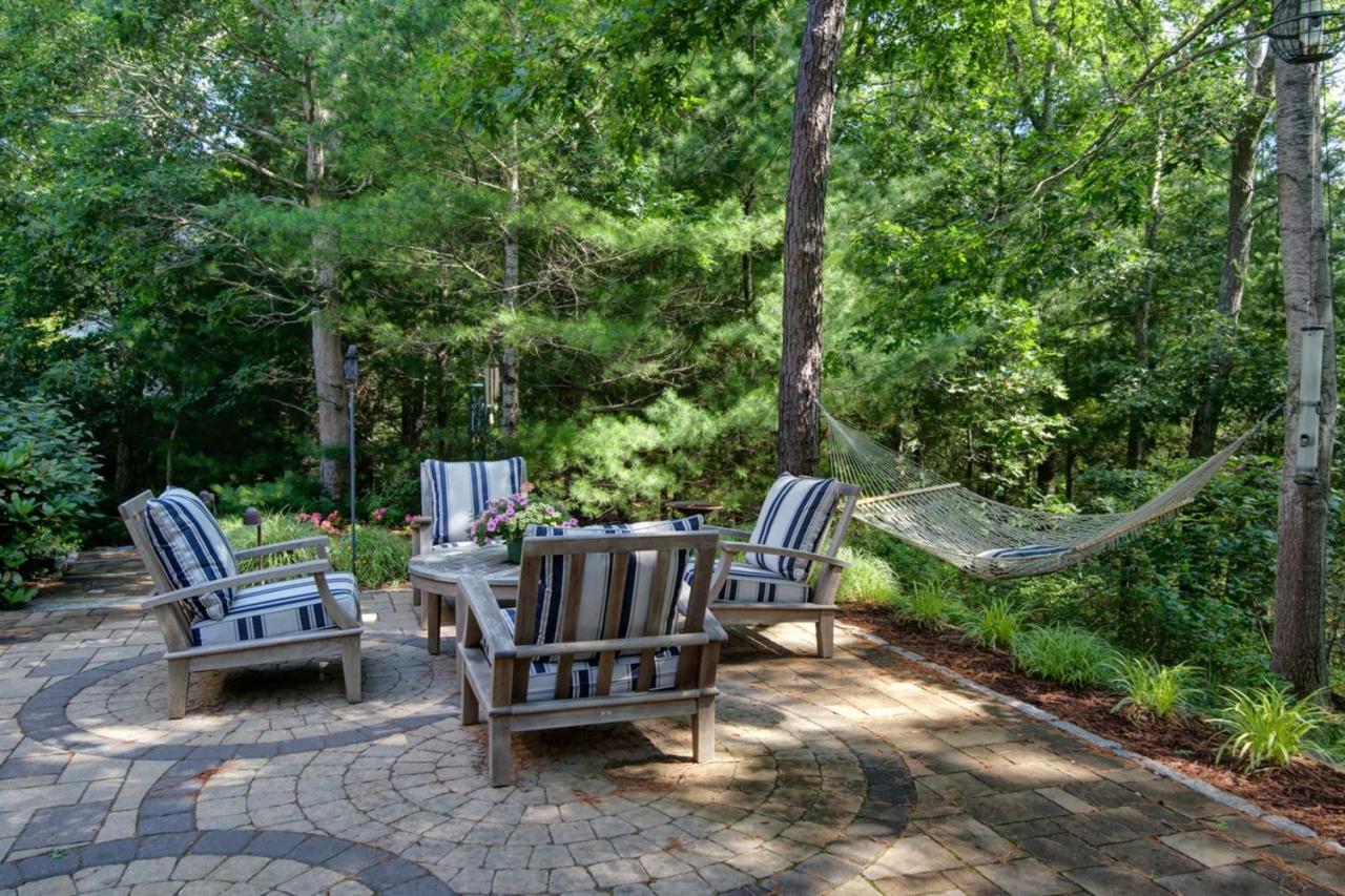 11 Harbor Ridge Road Mashpee, MA 02649 - Photo 19 of 33 a view of backyard with outdoor seating and trees