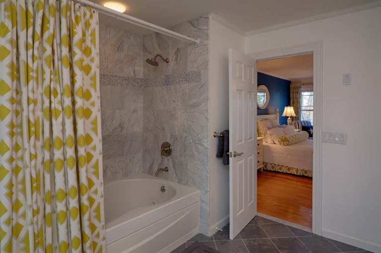 11 Harbor Ridge Road Mashpee, MA 02649 - Photo 28 of 33 a bathroom with a tub and shower