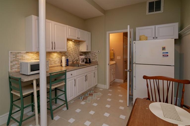 11 Harbor Ridge Road Mashpee, MA 02649 - Photo 30 of 33 a kitchen with stainless steel appliances a refrigerator sink and cabinets