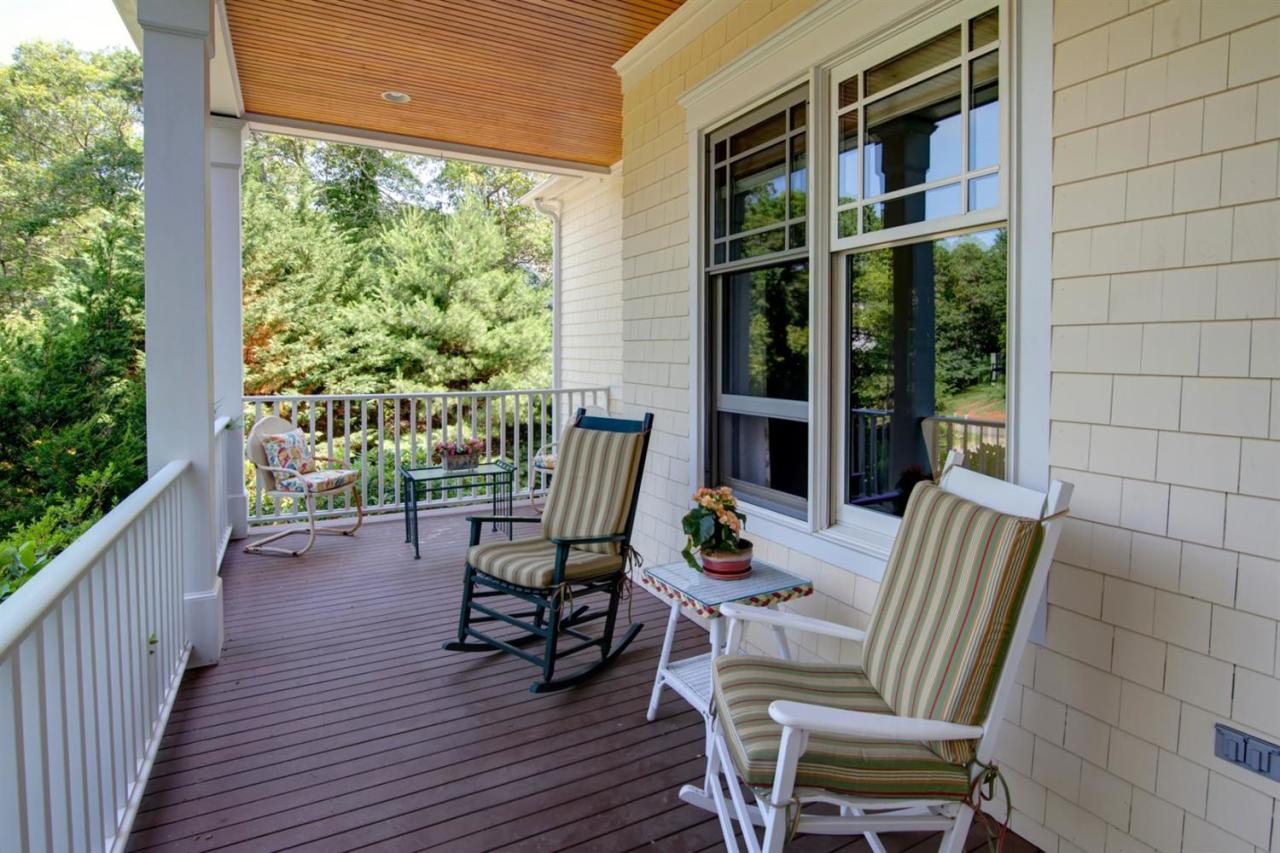 11 Harbor Ridge Road Mashpee, MA 02649 - Photo 6 of 33 a view of a deck with chairs and wooden floor