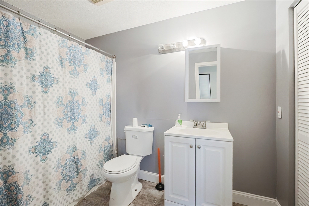 28 Walden Drive, Unit 17 Natick, MA 01760 - Photo 20 of 34 a bathroom with a sink toilet and shower