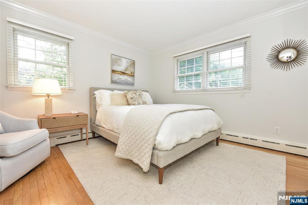 60 Dimmig Road Upper Saddle River, NJ 07458 - Photo 27 of 40 a bedroom with a bed couch and window