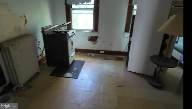 a view of storage and utility room with windows