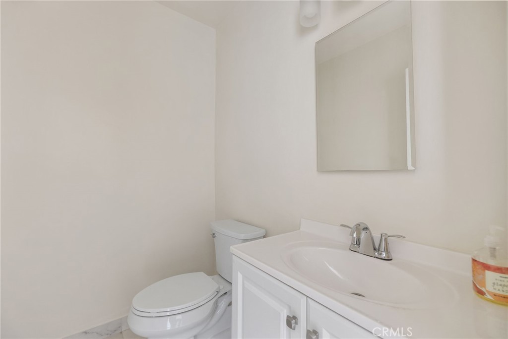 7137 Ramsgate Avenue Los Angeles, CA 90045 - Photo 11 of 14 a bathroom with a sink toilet and vanity