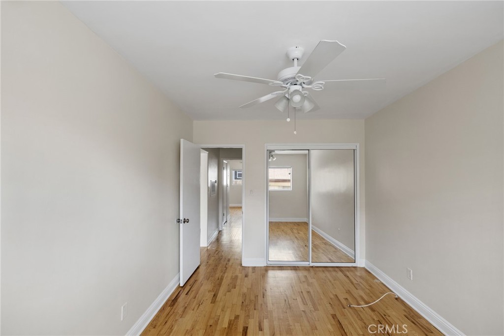 7137 Ramsgate Avenue Los Angeles, CA 90045 - Photo 13 of 14 a view of a hallway with wooden floor