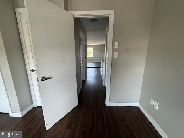 a view of gallery with wooden floor