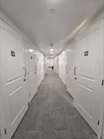 a view of a hallway with stairs