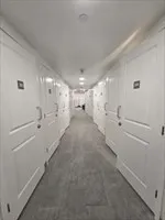 a view of a hallway with stairs