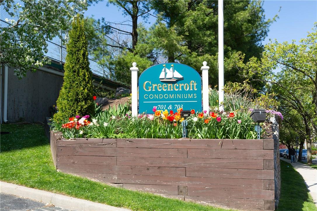 a sign that is in front of flowers