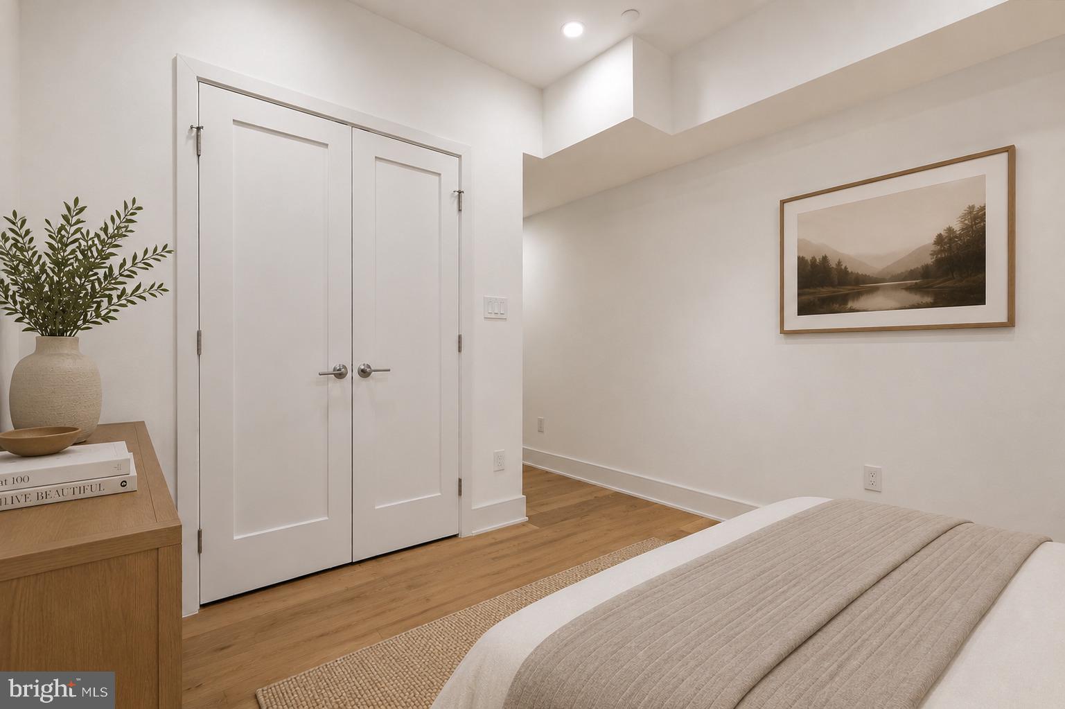 1810 Central Place Northeast, Unit 1 Washington, DC 20002 - Photo 21 of 36 a bedroom with a bed and a potted plant