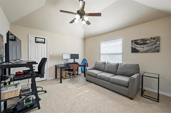 a work room with furniture and a window