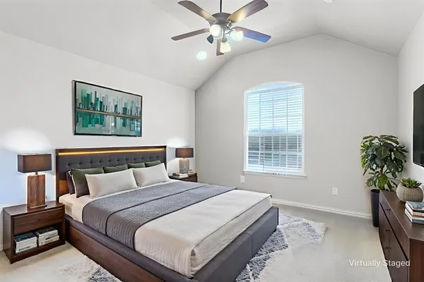 a bedroom with bed and a window