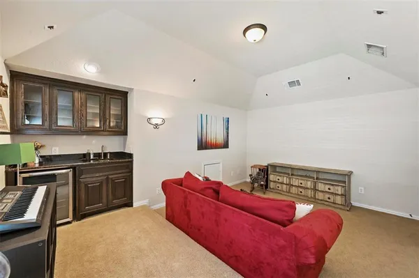 a kitchen with stainless steel appliances granite countertop a stove top oven a sink and dishwasher