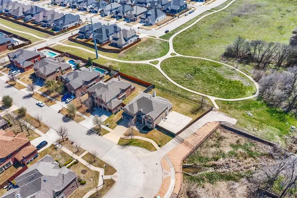 an aerial view of a house with a swimming pool