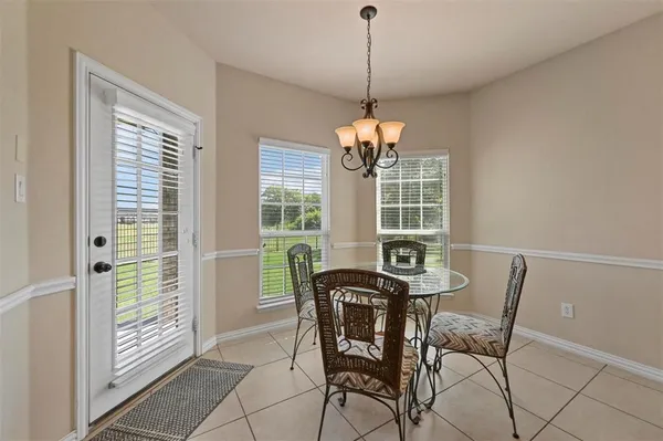 a view of a dining room with furniture window and outside view