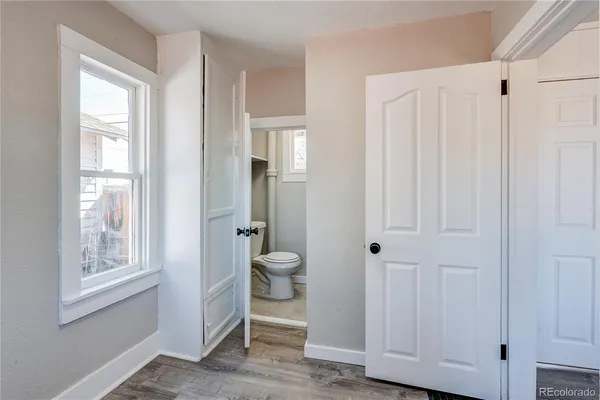 a bathroom with a window and a shower