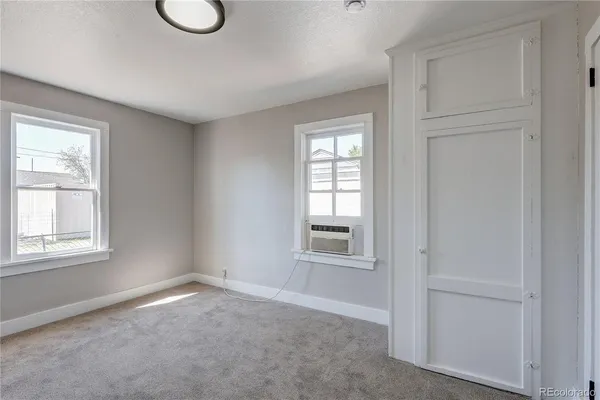 an empty room with windows