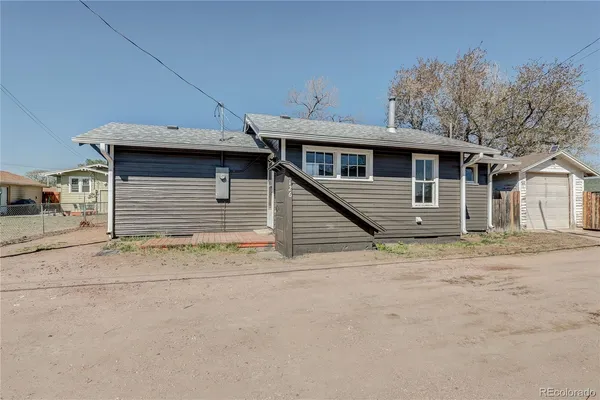 a front view of a house with a garage