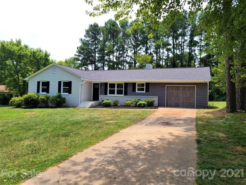1 Old Farm Road Salisbury, NC 28147 - Photo 1 of 4 a front view of a house with a yard and garage
