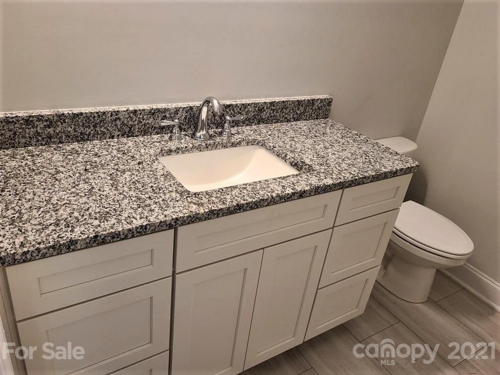 1 Old Farm Road Salisbury, NC 28147 - Photo 4 of 4 a bathroom with a granite countertop sink and a toilet