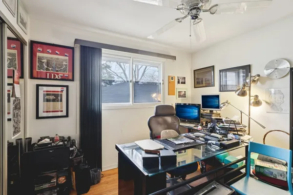 a living room with furniture a rug and a chandelier