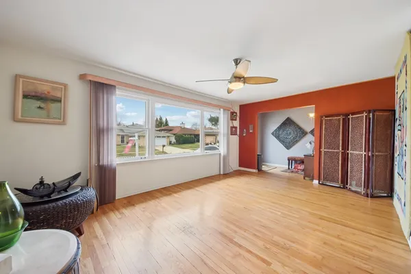 a bedroom with furniture and a window