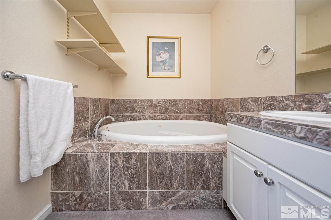 3345 Skyline Boulevard Reno, NV 89509 - Photo 16 of 38 a bathroom with a sink and a mirror