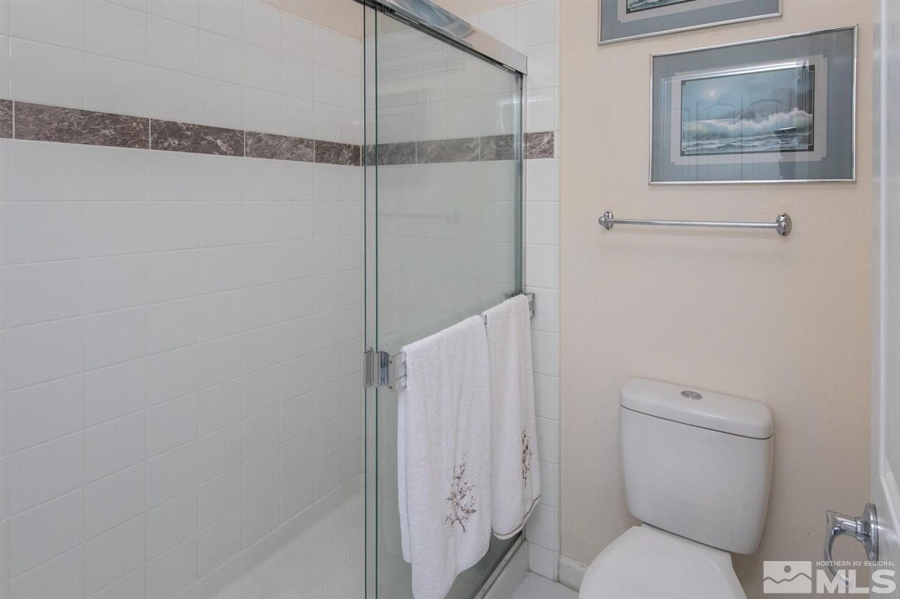 3345 Skyline Boulevard Reno, NV 89509 - Photo 17 of 38 a white toilet sitting next to a shower