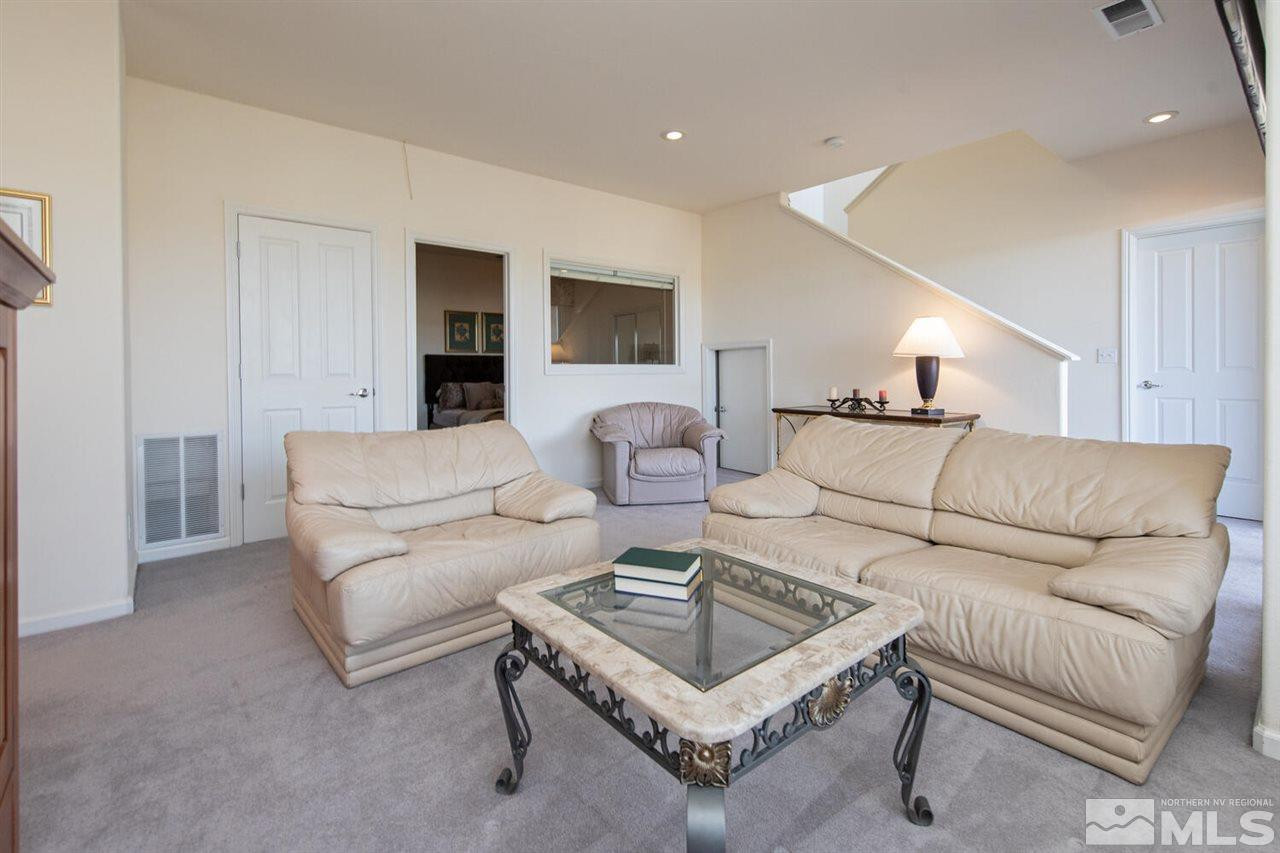 3345 Skyline Boulevard Reno, NV 89509 - Photo 19 of 38 a living room with furniture and a table