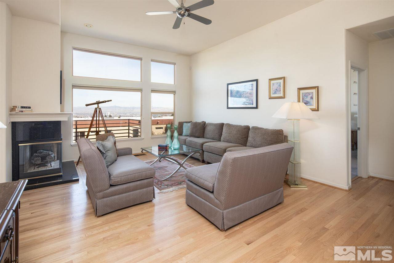 3345 Skyline Boulevard Reno, NV 89509 - Photo 2 of 38 a living room with furniture and a fireplace