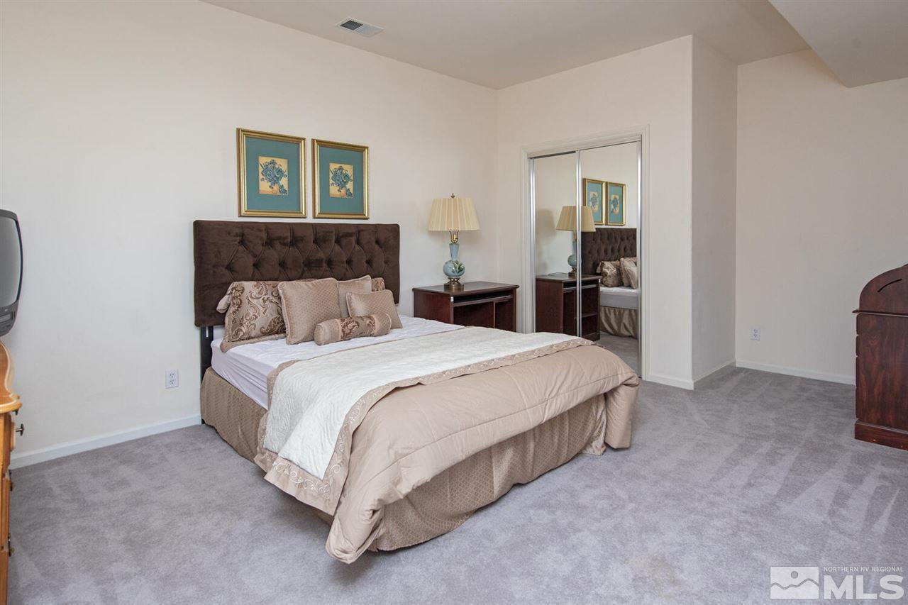3345 Skyline Boulevard Reno, NV 89509 - Photo 23 of 38 a bedroom with a bed and a painting