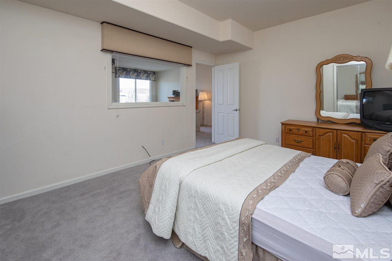 3345 Skyline Boulevard Reno, NV 89509 - Photo 24 of 38 a bedroom with a bed and window