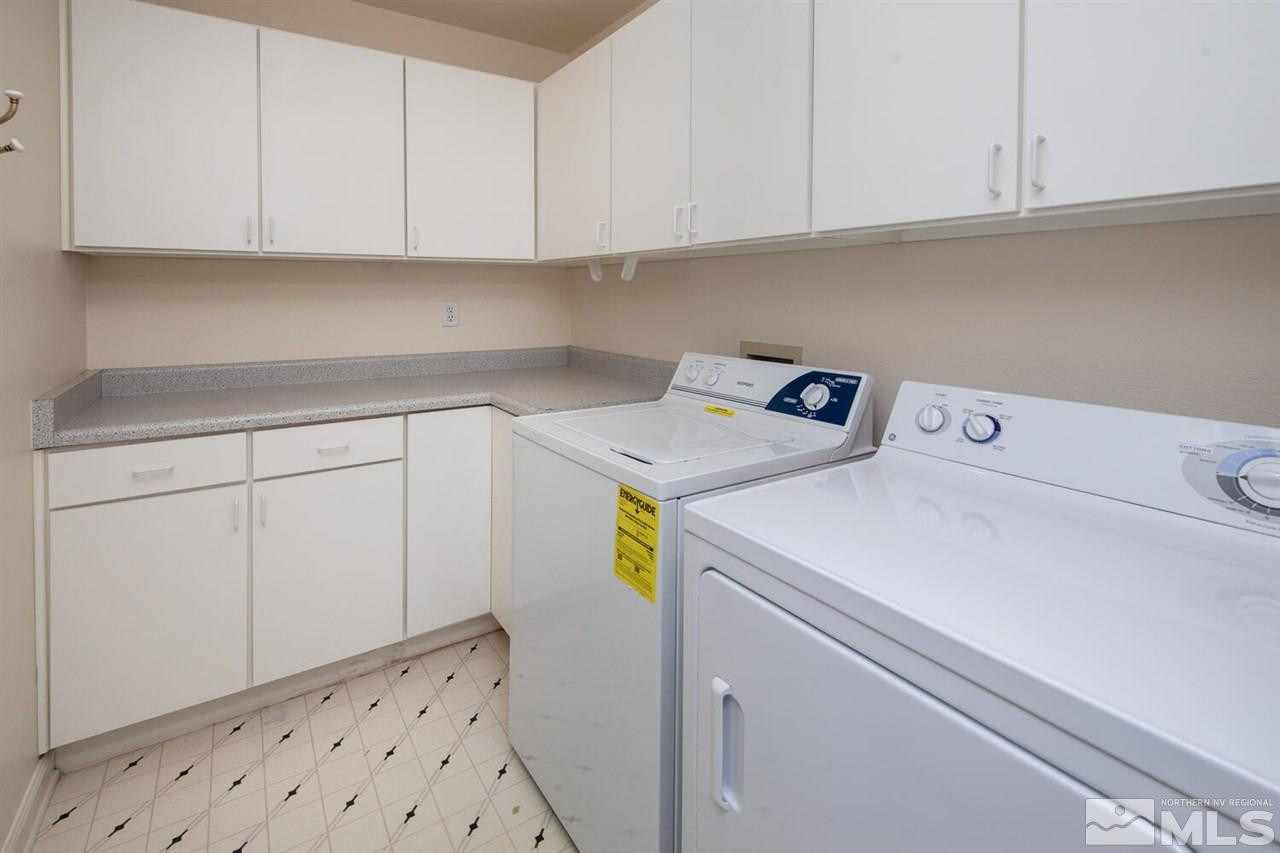 3345 Skyline Boulevard Reno, NV 89509 - Photo 25 of 38 a utility room with dryer and cabinets