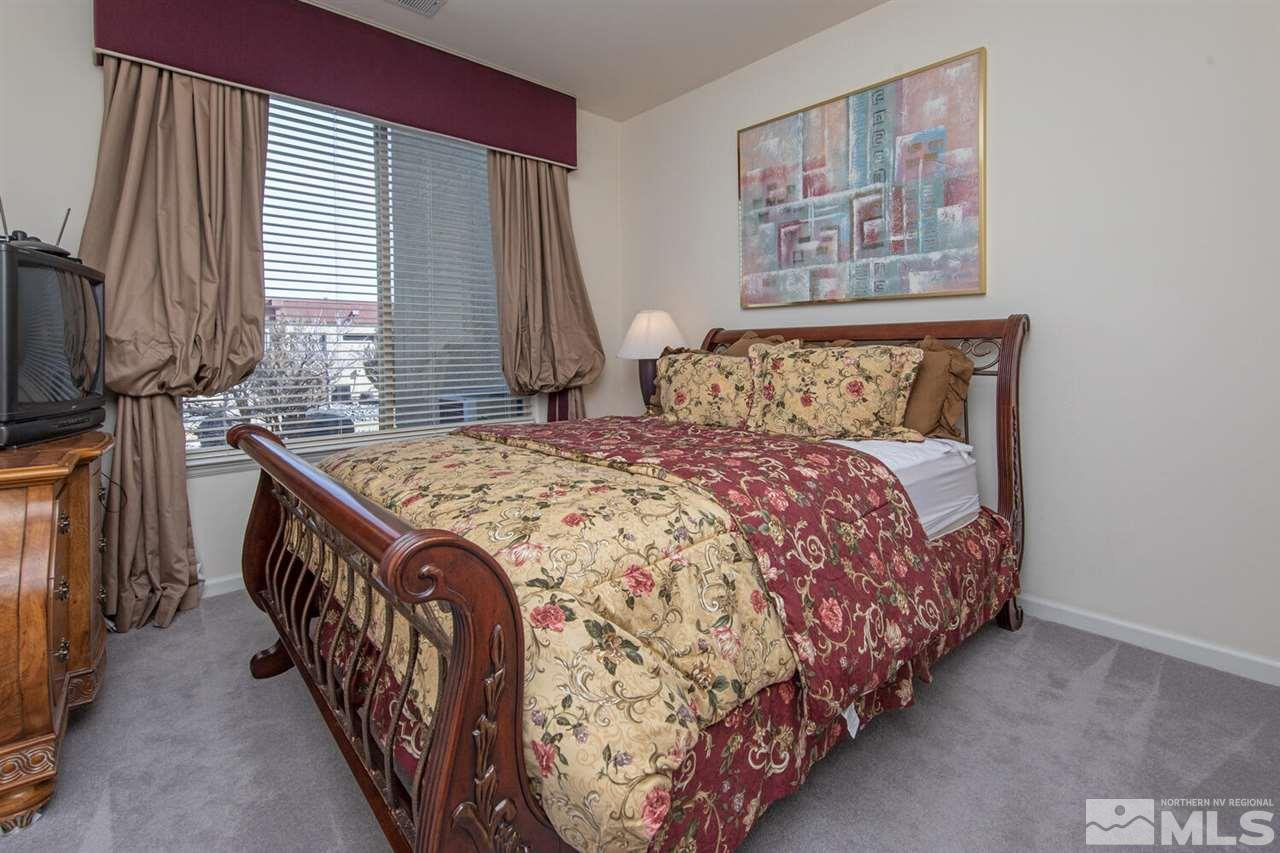 3345 Skyline Boulevard Reno, NV 89509 - Photo 26 of 38 a bed sitting in a bedroom next to a window