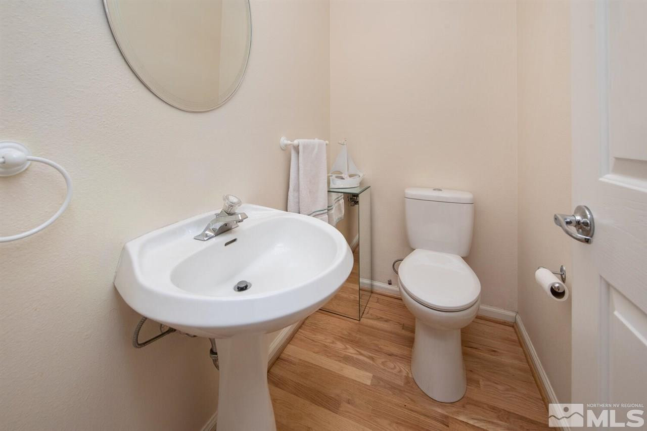 3345 Skyline Boulevard Reno, NV 89509 - Photo 6 of 38 a bathroom with a sink a toilet and a mirror