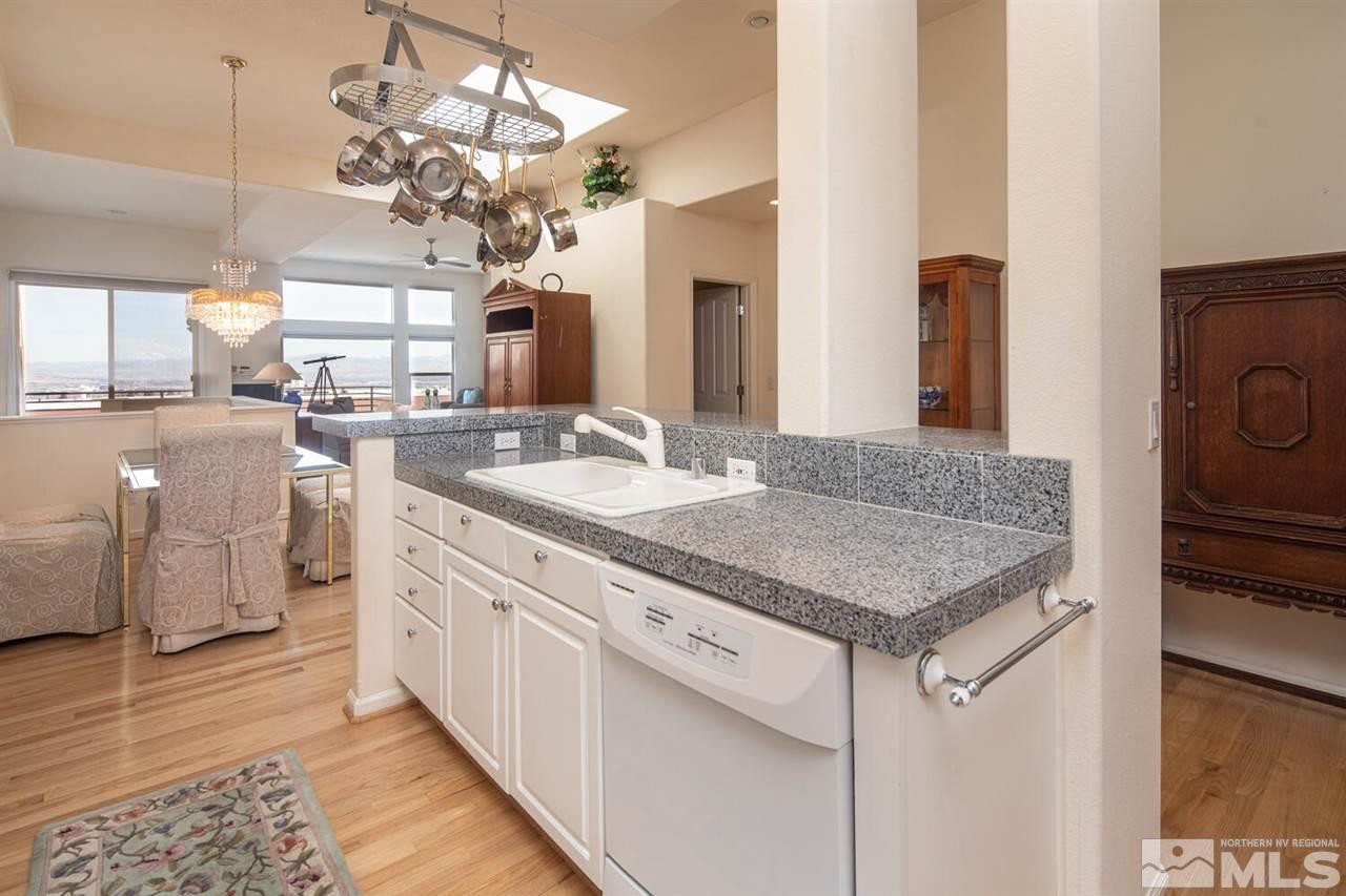 3345 Skyline Boulevard Reno, NV 89509 - Photo 10 of 38 a kitchen with stainless steel appliances granite countertop a sink and dishwasher