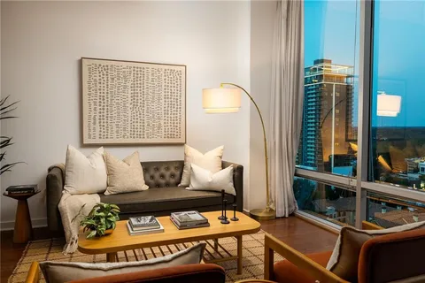 a living room with furniture and a window