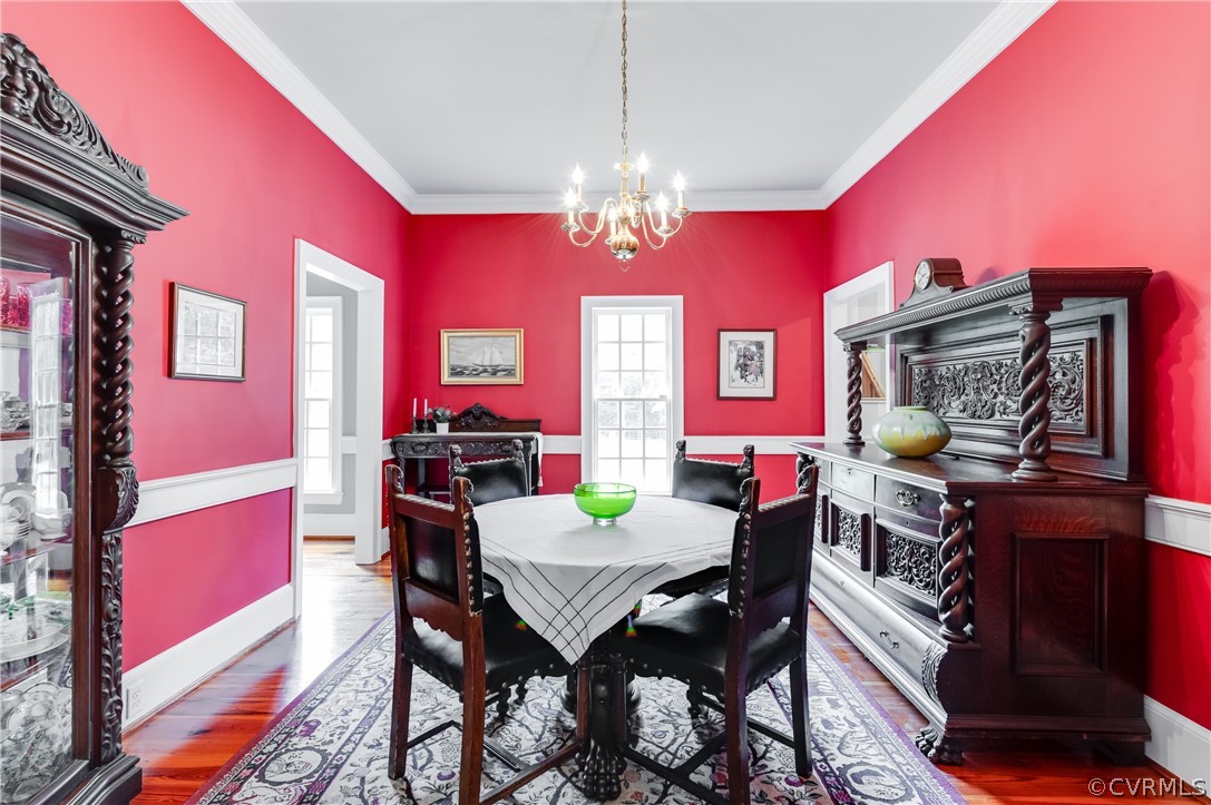 1290 Johns Road Carson, VA 23830 - Photo 15 of 48 a view of a dining room with furniture and chandelier