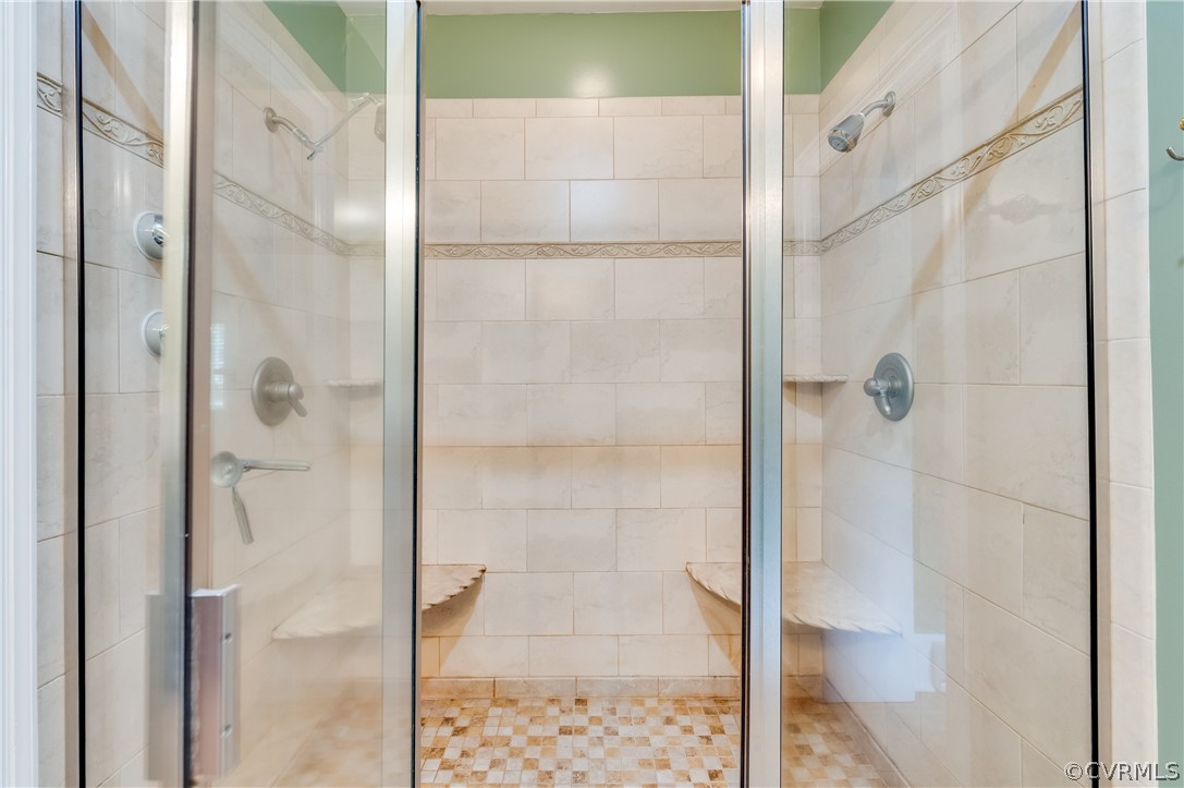 1290 Johns Road Carson, VA 23830 - Photo 23 of 48 a bathroom with a glass shower door