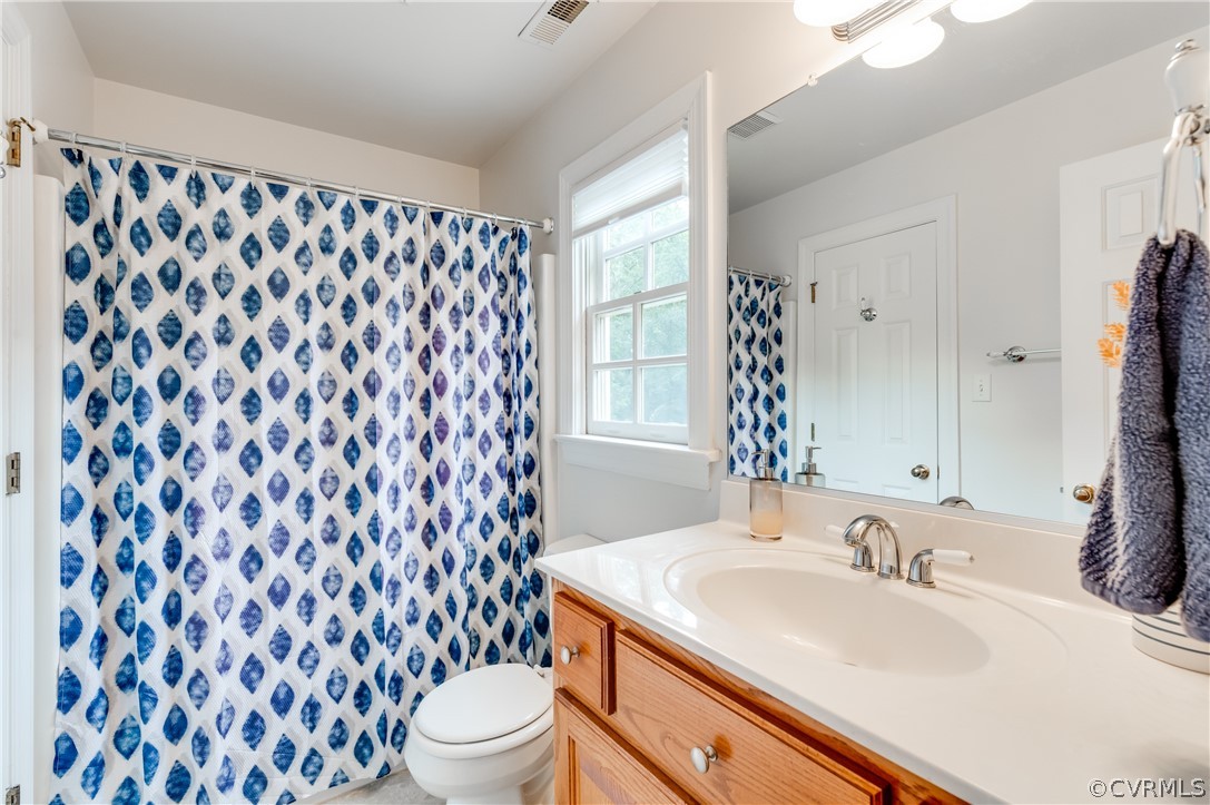 1290 Johns Road Carson, VA 23830 - Photo 26 of 48 a bathroom with a sink and a mirror