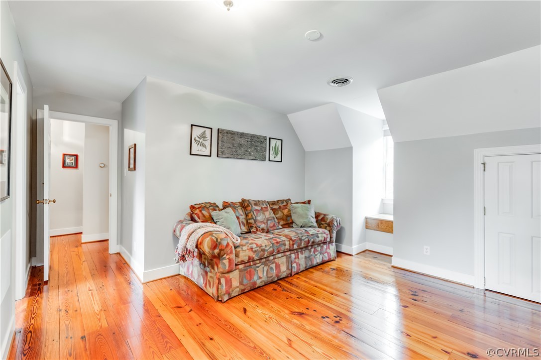 1290 Johns Road Carson, VA 23830 - Photo 28 of 48 a living room with furniture and a wooden floor